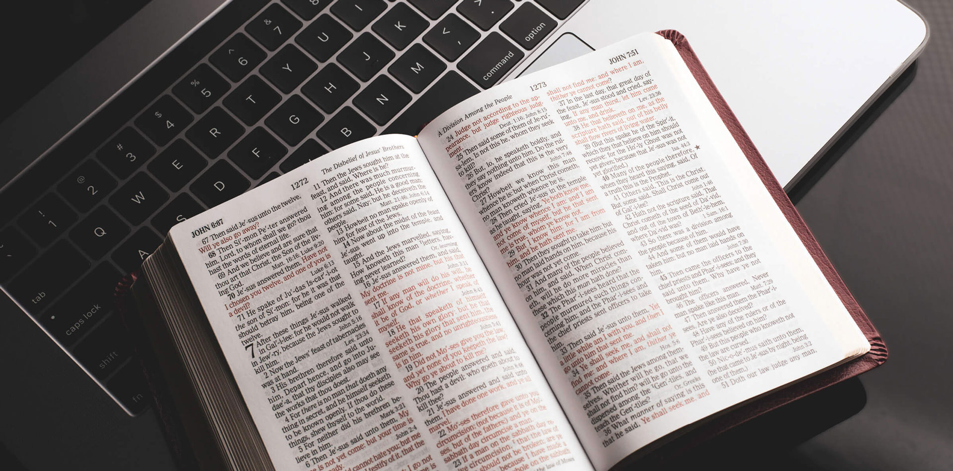 Bible laying open on laptop