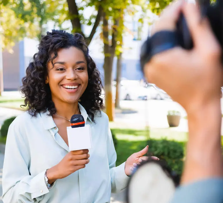 Regent University journalism student giving a news anchor report