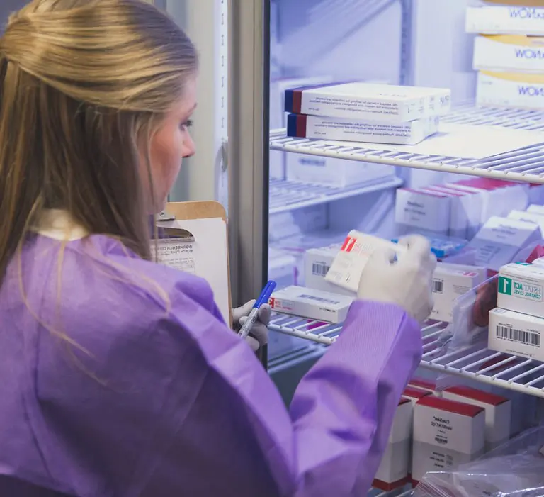Woman looking at medication