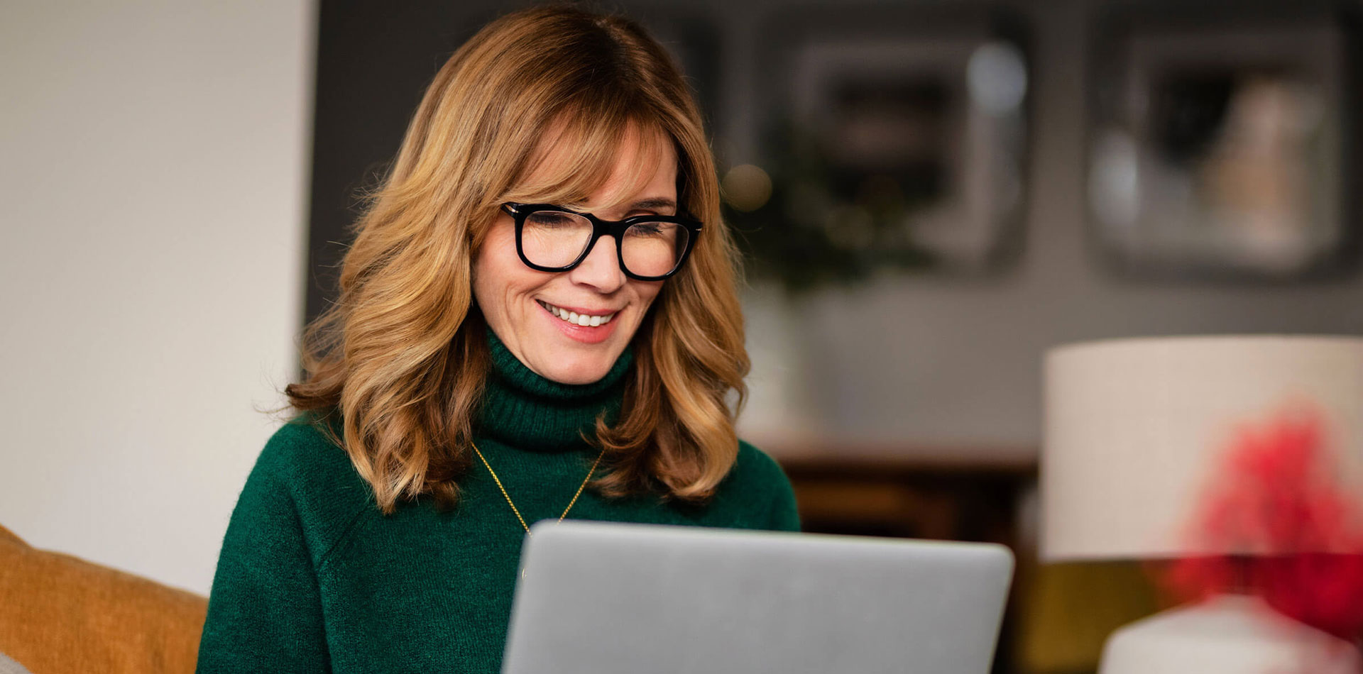 Woman looking at laptop
