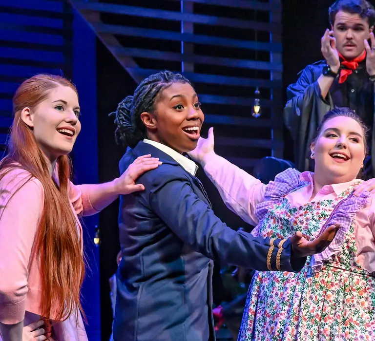 Regent students acting in a theatre show.