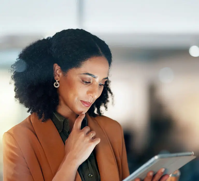 A psychologist looking at her tablet.